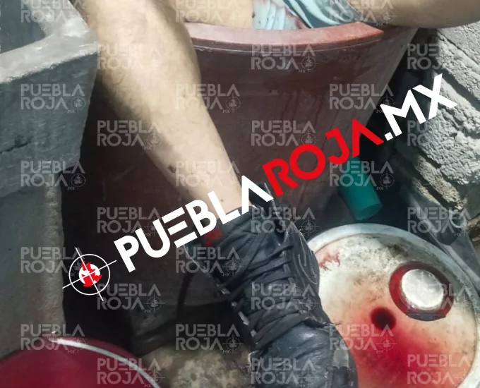 Hallan a comerciante degollado y sumergido en tambo de agua en Izúcar